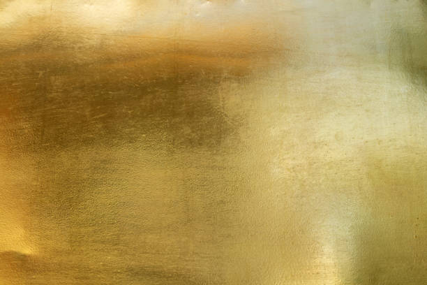 istock gold foil background with golden textured wall reflection 1392461867