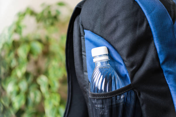 istock Black and blue rucksack with bottle of water 1392462916