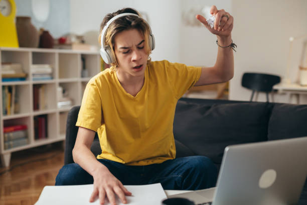 istock teenager boy at home 1392465053