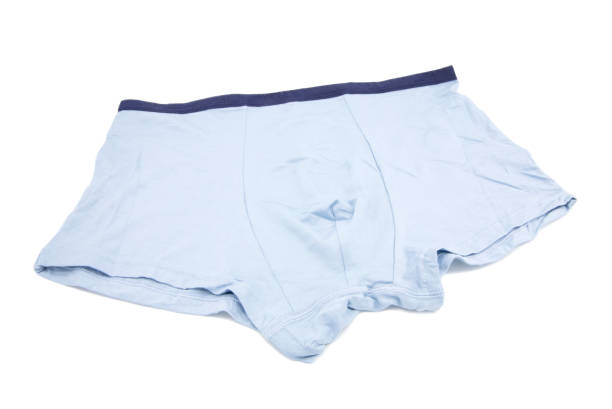 istock Light blue underpants and clothing isolated on white background. 1392468407