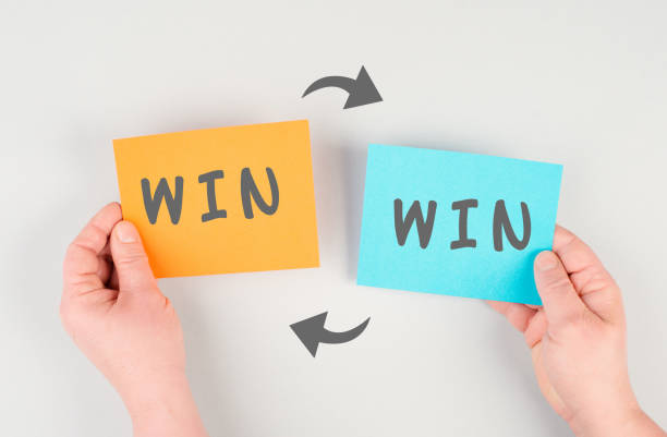 The word win is standing on paper, problem solving, winner mindset, business and education concept, coaching and motivation stock photo