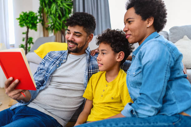 istock African-American family reading a book 1392470569