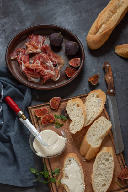 istock Jamon with figs and a baguette with cream cheese 1392472117