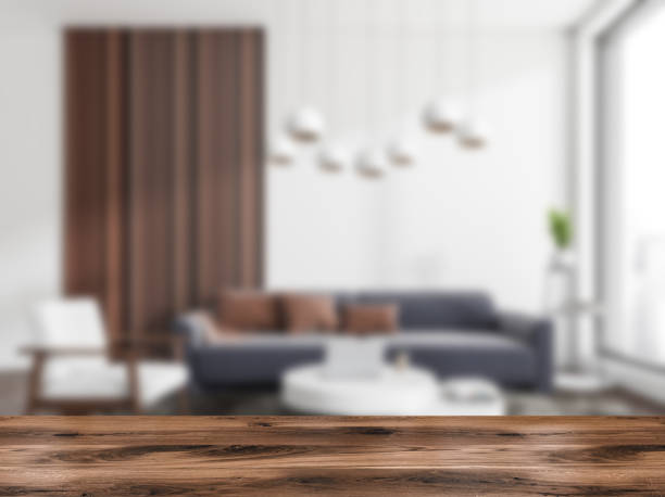 istock Light relax room interior with seats and wooden desk blurred. Mockup 1392472421