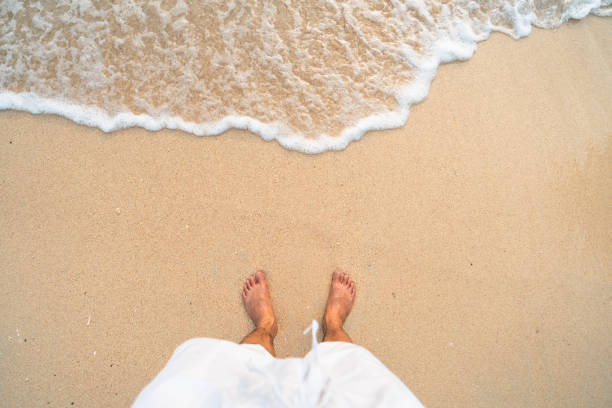 istock sea, beach and rocky mountains in tropical evening 1392472472