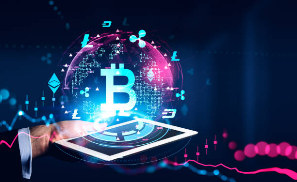 istock Hand with tablet, stock market with bitcoin hologram, cryptocurrency 1392472487