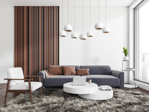 istock Chill zone interior with sofa and armchair, coffee table and panoramic window 1392473446
