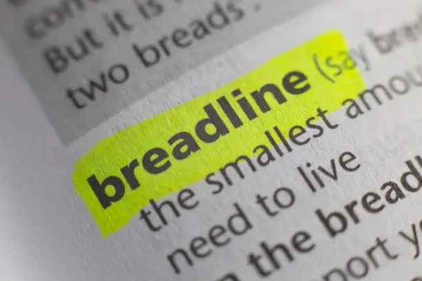 The word breadline printed and defined in an English dictionary