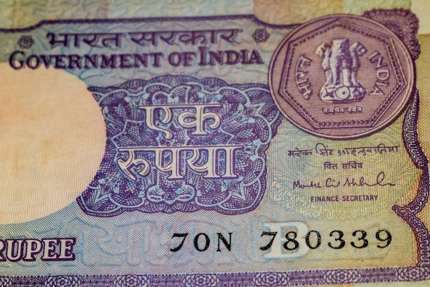 istock Old One Rupee notes combined on the table, India money on the rotating table. Old Indian Currency notes on a rotating table, Indian Currency on the table 1392484721