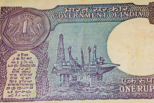 istock Old One Rupee notes combined on the table, India money on the rotating table. Old Indian Currency notes on a rotating table, Indian Currency on the table 1392484723
