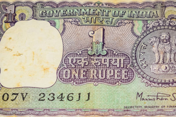 istock Old One Rupee notes combined on the table, India money on the rotating table. Old Indian Currency notes on a rotating table, Indian Currency on the table 1392484750