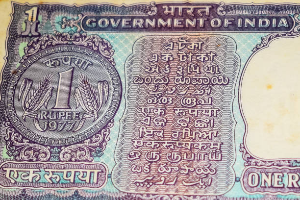 istock Old One Rupee notes combined on the table, India money on the rotating table. Old Indian Currency notes on a rotating table, Indian Currency on the table 1392484751