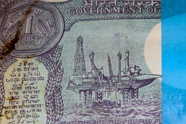 istock Old One Rupee notes combined on the table, India money on the rotating table. Old Indian Currency notes on a rotating table, Indian Currency on the table 1392484753