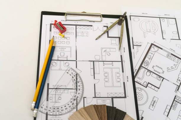 istock wooden vinyl samples with drawing instruments onn house plan blueprint 1392486354