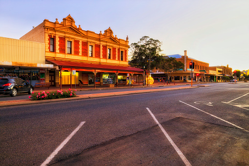 Shopping district and main Argent street of Broken Hill city in Australian outback at sunset.