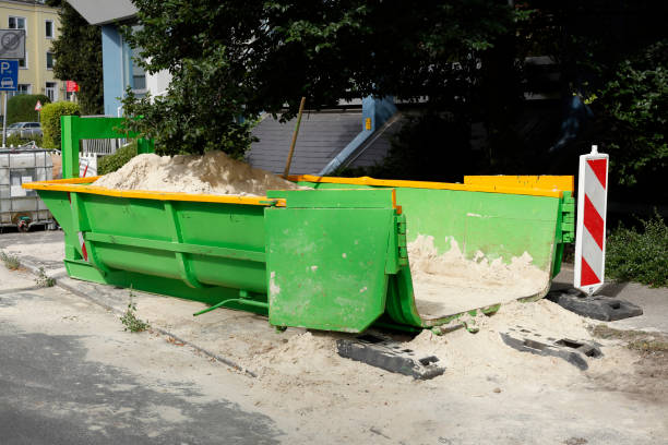 Container, green skip for construction rubble standing on the road Germany, Europe Container, green skip for construction rubble standing on the road Germany, Europe erde stock pictures, royalty-free photos & images