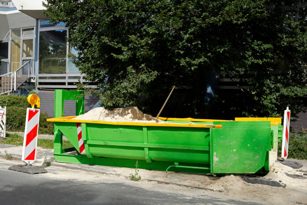 Container, green skip for construction rubble standing on the road Germany, Europe Container, green skip for construction rubble standing on the road Germany, Europe erde stock pictures, royalty-free photos & images