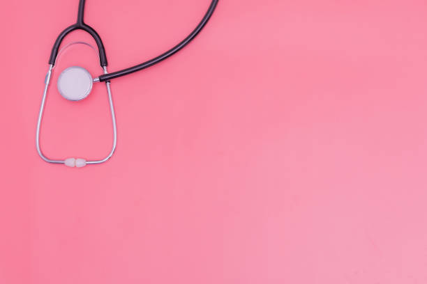 istock stethoscope on pink background and copy space 1392489096