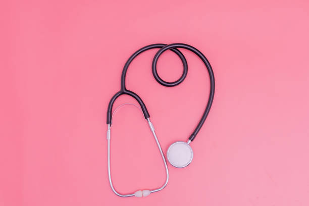 istock stethoscope on pink background and copy space 1392489118