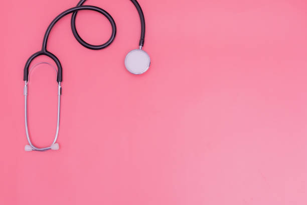 istock stethoscope on pink background and copy space 1392489135