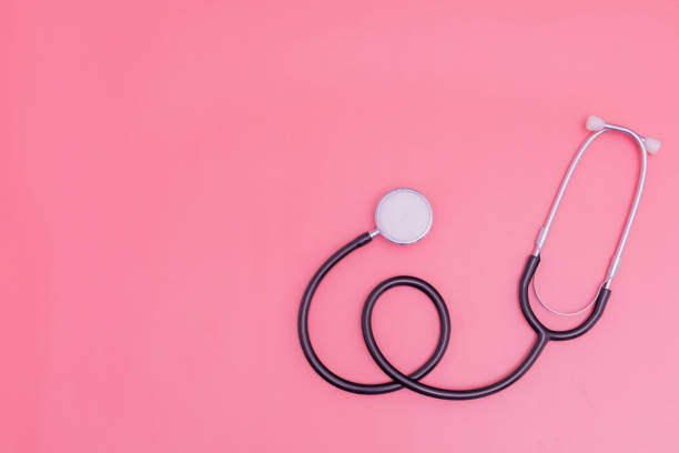 istock stethoscope on pink background and copy space 1392489195