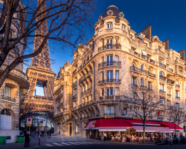 Paris, France - February 7, 2022: Eiffel tower between haussman buildings in Paris