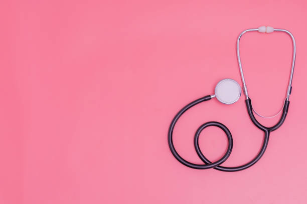 istock stethoscope on pink background and copy space 1392489522