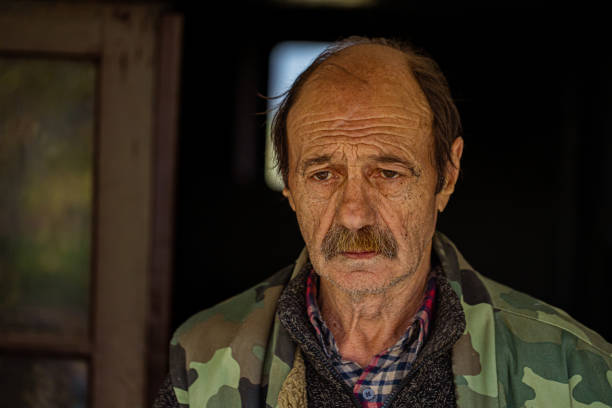 istock Sad older man with a sorrow in his eyes 1392491618