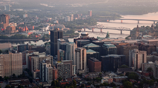 Aerial view of downtown Ottawa with Ottawa River and Alexandra Bridge during sunrise in Ontario, Canada.