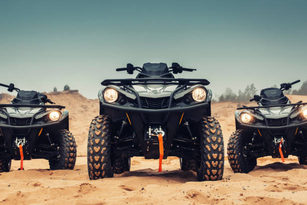 istock Quad bikes on the sands of a desert. 1392498802