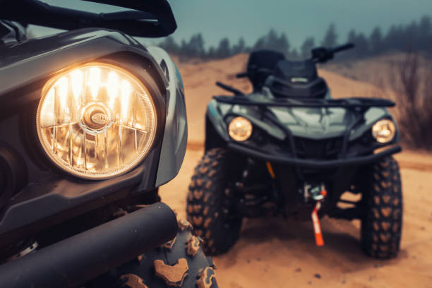 istock Quad bikes on the sands of a desert. 1392498949