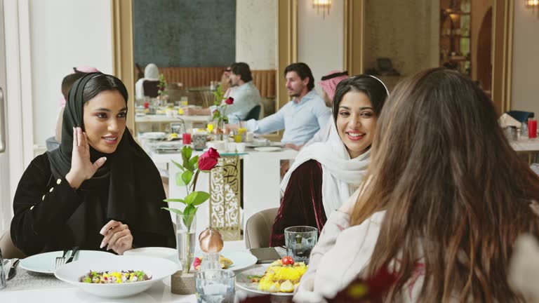 Middle Eastern female friends lunching at Riyadh restaurant