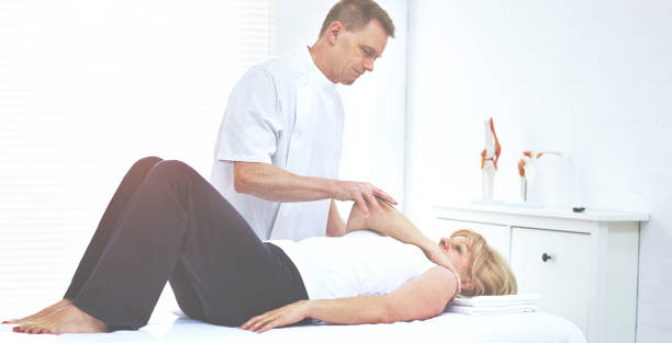 istock Shot of a chiropractor adjusting a clients shoulder 1392501030