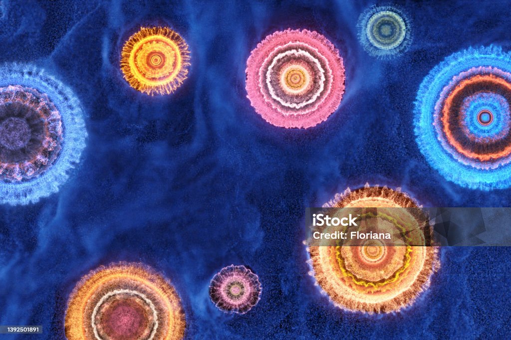 Celebration background Multicolored powder form circles, stars or fireworks on dark blue background, CGI. Arts Culture and Entertainment Stock Photo