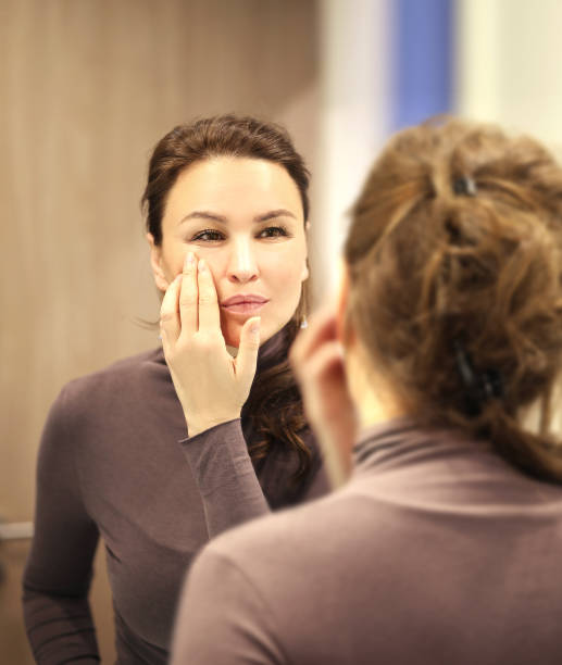 istock Magic anti-aging cream.Applying the cream. 1392502880