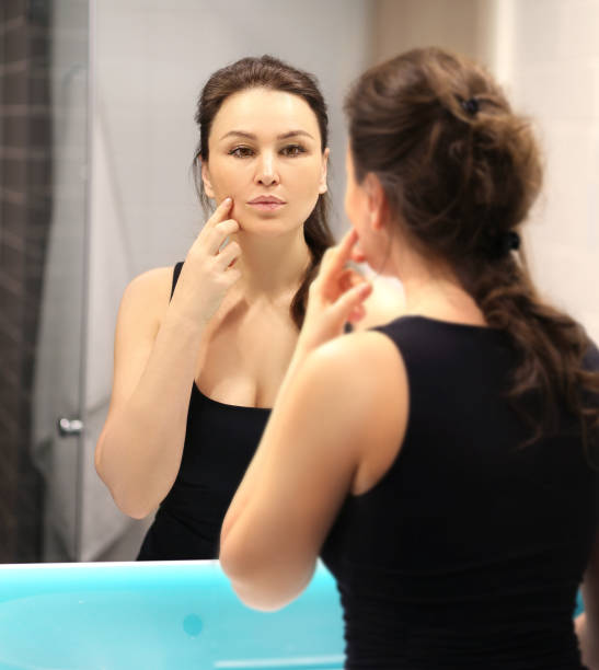 istock Magic anti-aging cream.Applying the cream. 1392502884