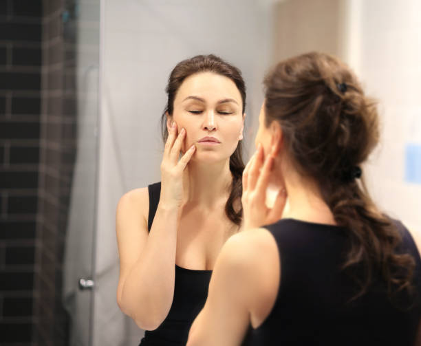 istock Magic anti-aging cream.Applying the cream. 1392502886