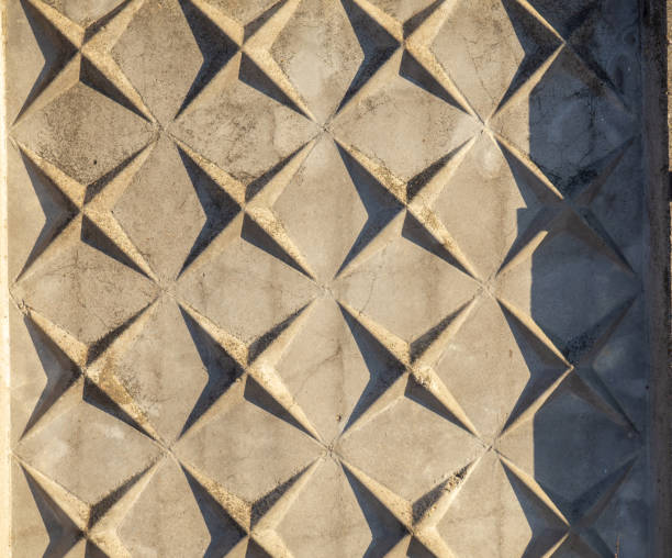 istock Concrete wall with abstract drawing. Cement.   Patterned background from the fence 1392505095