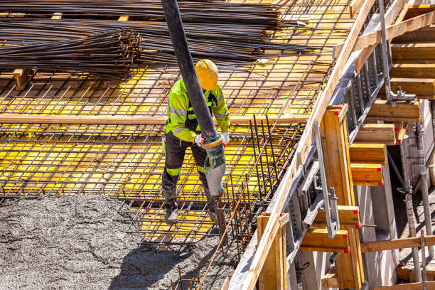 istock Concrete pouring on the construction site. 1392505730