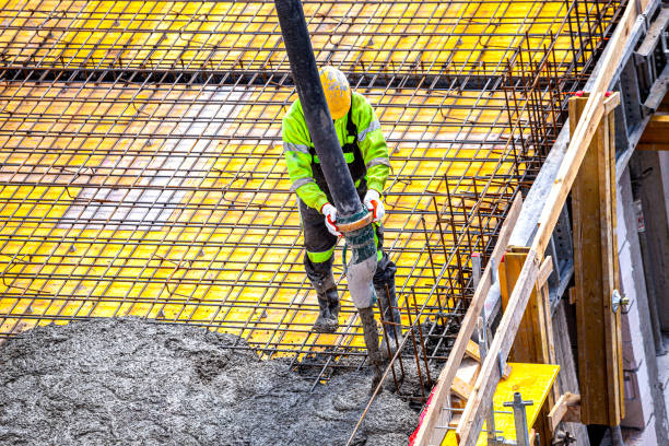 istock Concrete pouring on the construction site. 1392505745