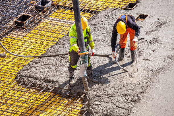 istock Concrete pouring on the construction site. 1392505770