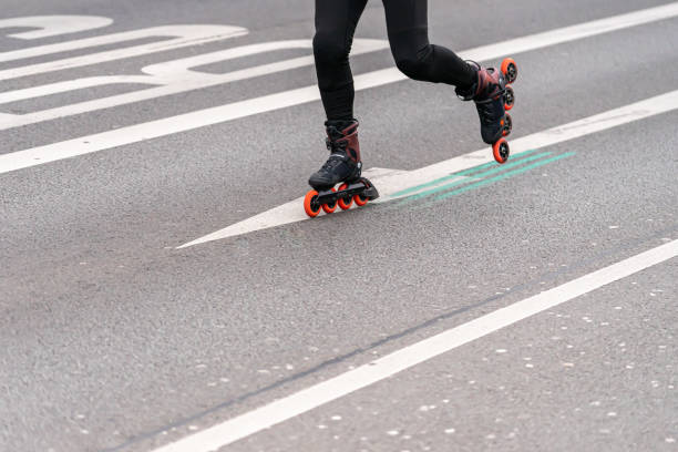 istock Low Section Of Man Skateboarding On Road 1392507306