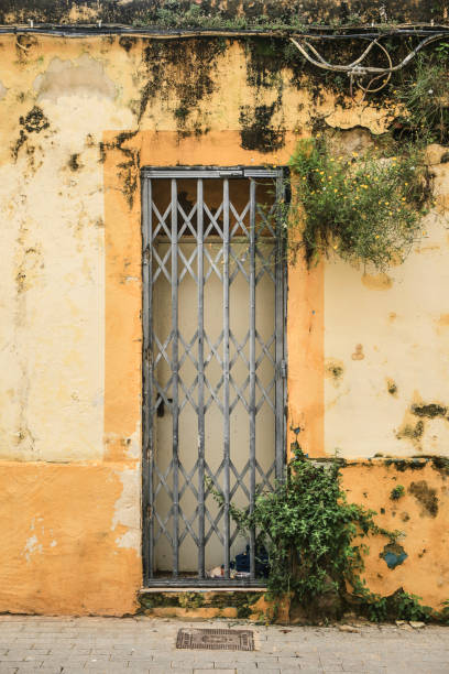 istock Door with geometric metal lattice on facade 1392513018