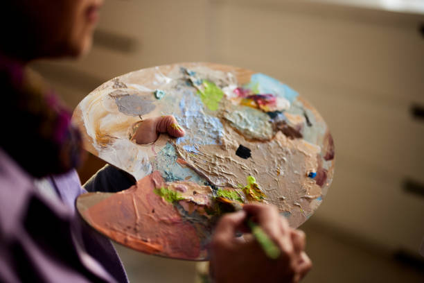 istock Colorful palette in artist's hand! 1392513241