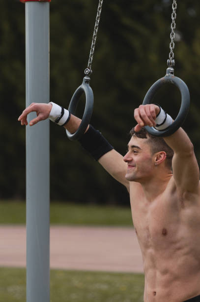 istock Young man practicing calisthenics outdoor. 1392516467