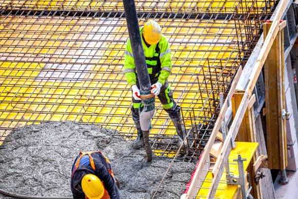 istock Concrete pouring on the construction site. 1392517240