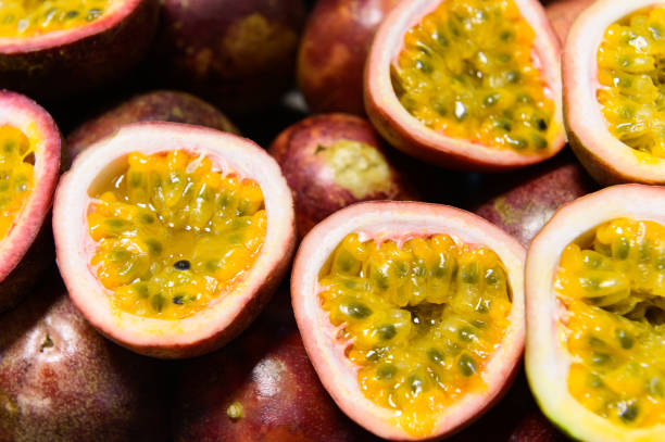 Group of passion fruits and its cross section with seeds stock photo