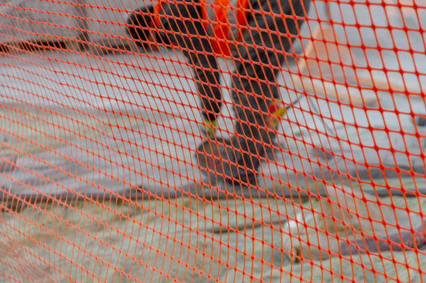 istock Red mesh for road works. Abstract background. Blur. 1392523406