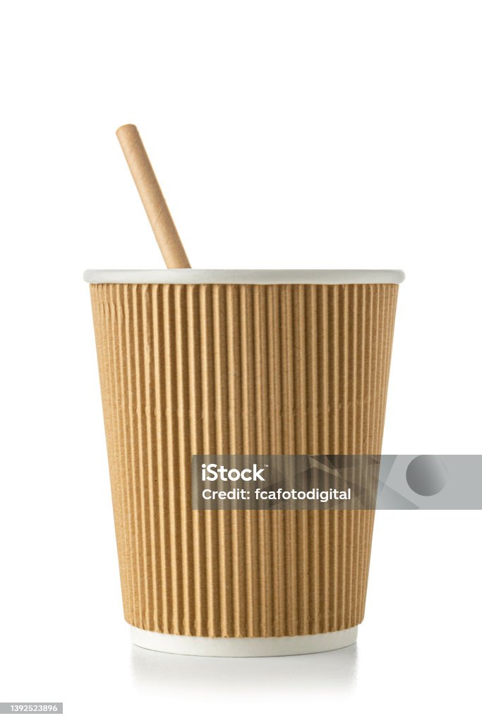 Close up of a disposable coffee cup on white. Sustainable lifestyle and environmental conservation: close up view of a plastic free eco friendly disposable coffee cup with a paper drinking straw inside isolated on white background. High resolution 42Mp studio digital capture taken with Sony A7rII and Sony FE 90mm f2.8 macro G OSS lens Biodegradable Stock Photo