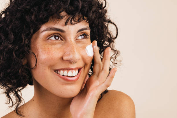 istock Caring for the skin with moisturizing cream 1392524949